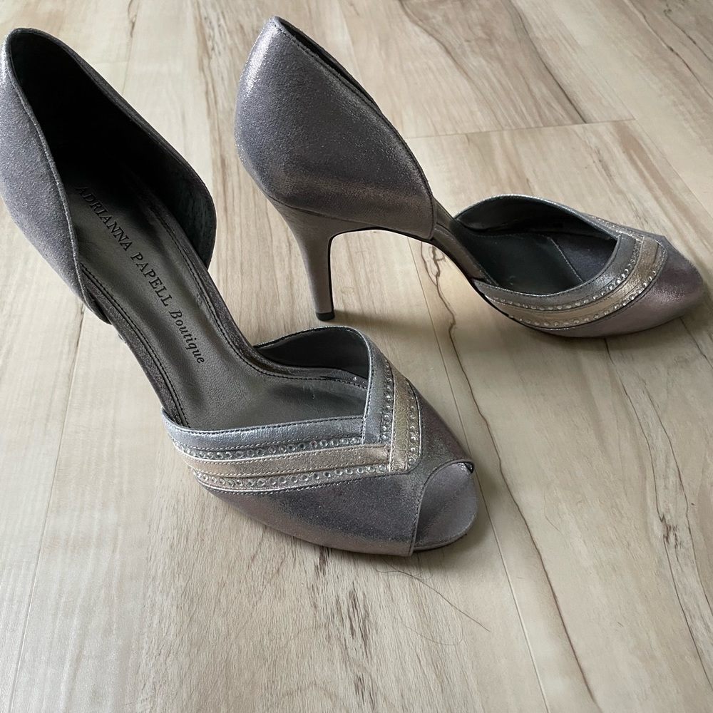 Gently worn metallic dress shoes.